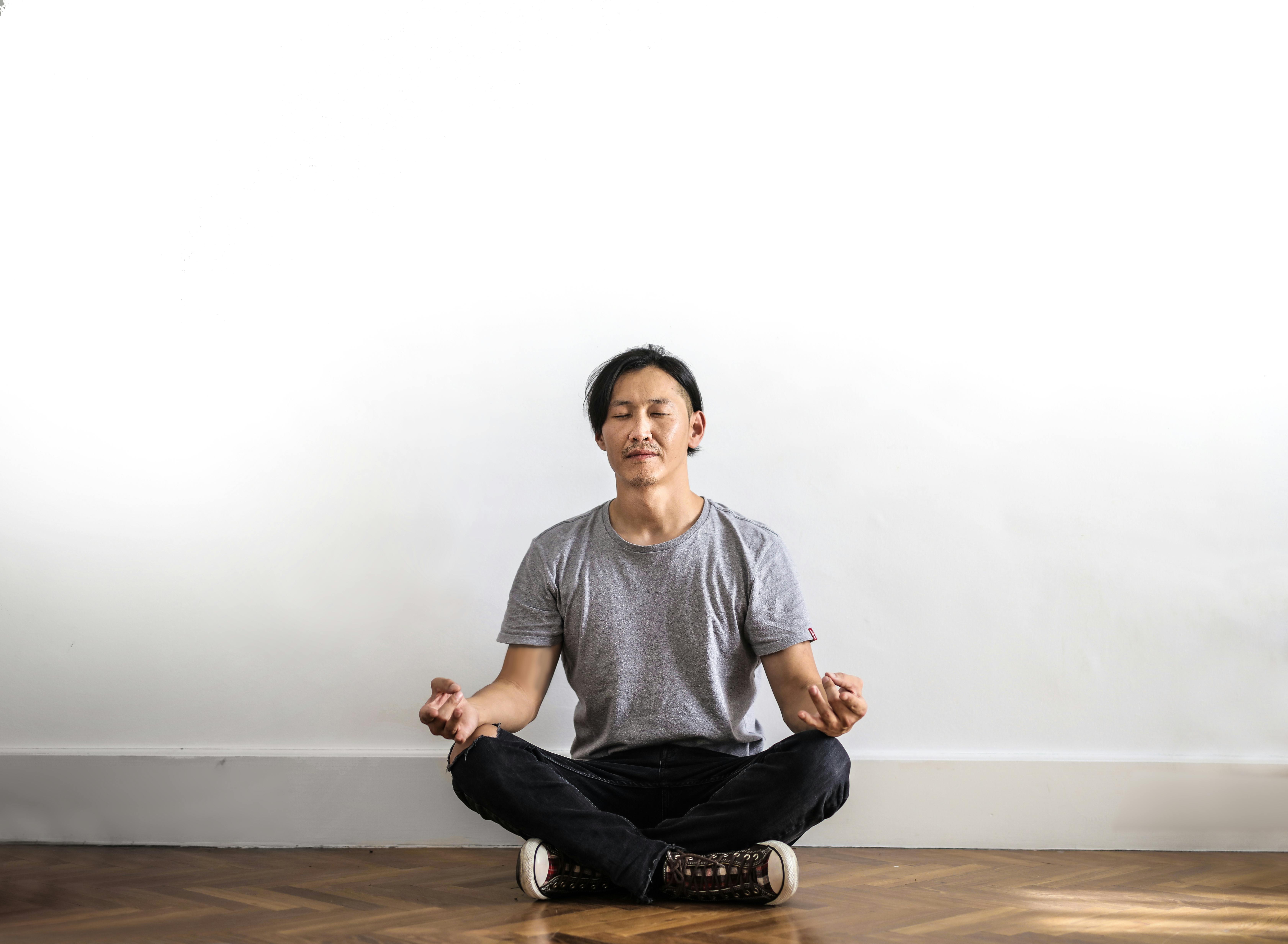 A man meditating cross-legged