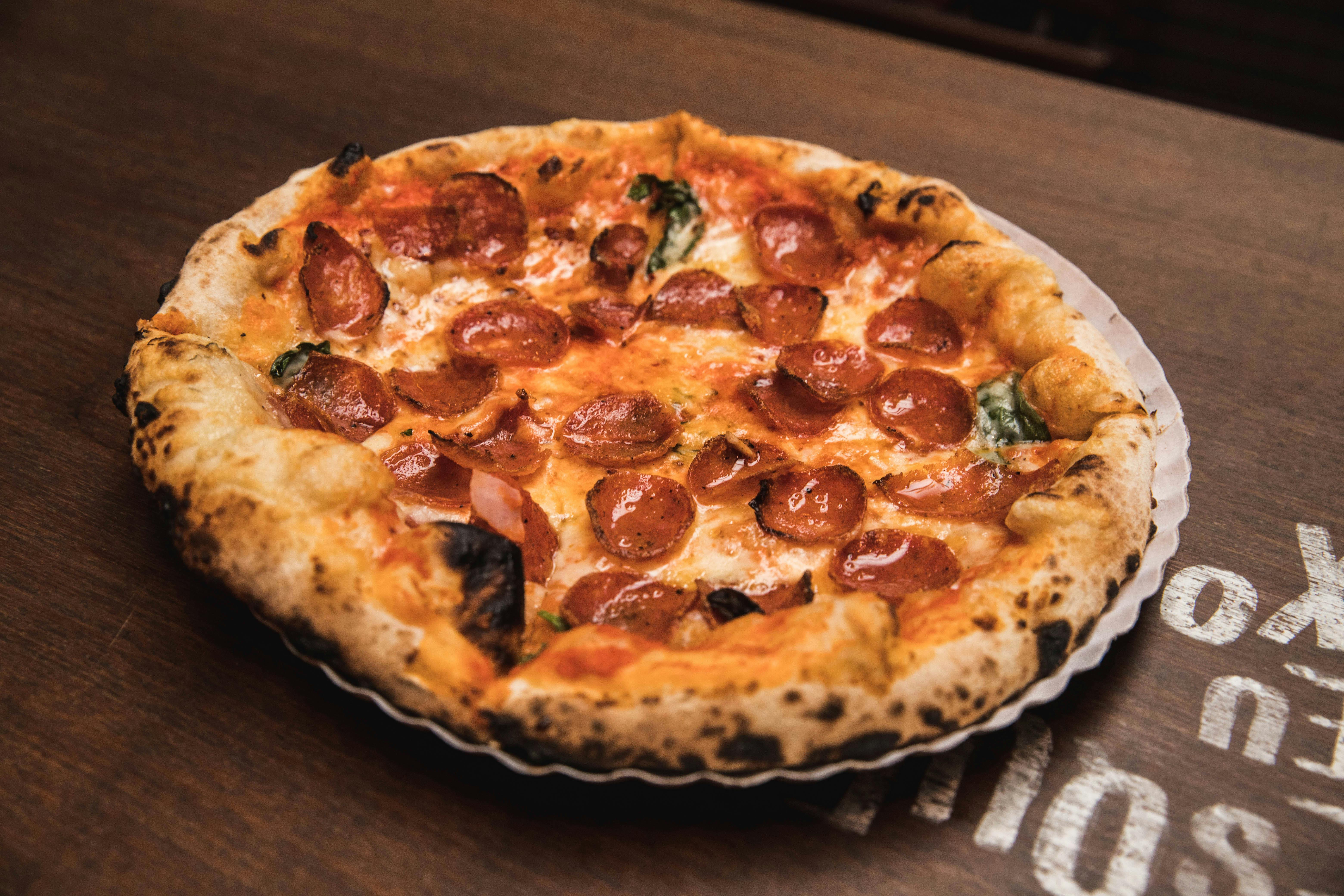 A pizza with cheese and pepperoni